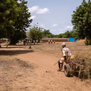 Returned migrants participate in development work in Burkina Faso.