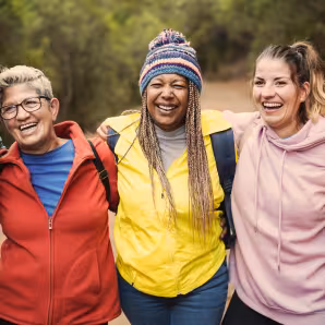 Image of women smiling on hike