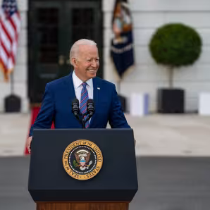 Photo of U.S. President Joe Biden delivering remarks in front of White House.