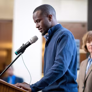 Image of aspiring pastor and DACA recipient speaking at DACA event in Minneapolis
