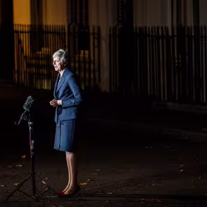 Theresa May speaks to reporters