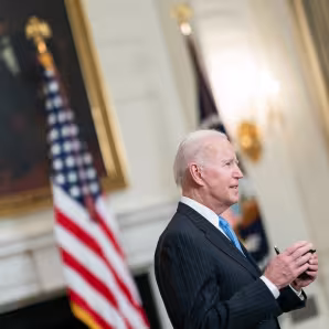 President Joe Biden speaks to journalists at the White House.