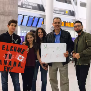 Canadians welcome Syrian refugees to Toronto.
