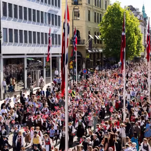 Norwegian Parliament President Masud Gharahkhani greets a children's procession