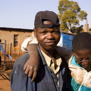 Two boys pose in an informal settlement east of Johannesburg largely populated by immigrants.