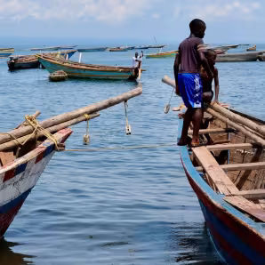 Boys on a fishing boat on the shores of Lake Tanganyika