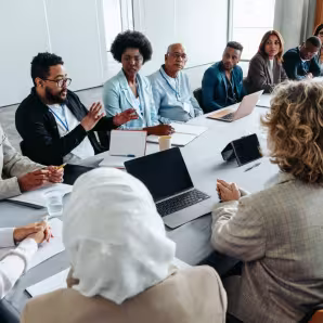 A group of people in a meeting.