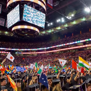 International students wave flags of their origin countries