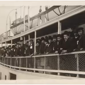 Immigrants arriving on a ferry near Ellis Island.