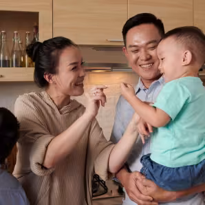 A Vietnamese family in the kitchen. 