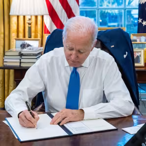 President Joe Biden signs an executive order.