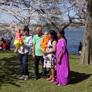 A family takes a photo in Washington, DC.