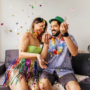 A couple celebrating carnival at home.