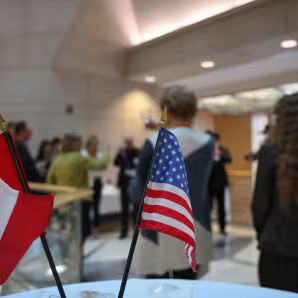 The flags of the United States and Canada.