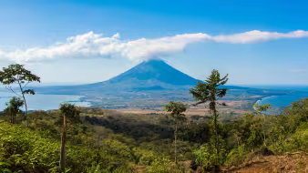 Volc&aacute;n Concepci&oacute;n, an active cone-shaped volcano rising above the tropical landscape of Ometepe Island, viewed from across Lake Nicaragua