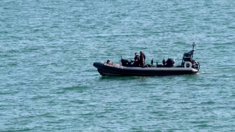 UK Border Patrol personnel in an inflatable boat 