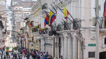 Many people walking along a busy street in Quito, Ecuador