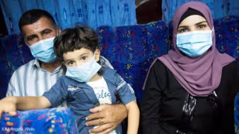 A family wearing face masks