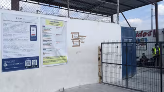 Photo of CBP One App poster at shelter in Reynosa, Mexico