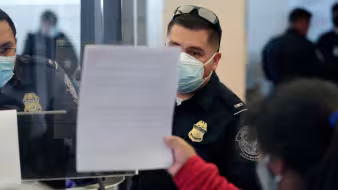 CBP agents process asylum seeker at El Paso, Texas port of entry