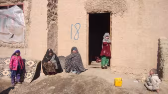 Women and children outside of home in Sohadat, Afghanistan