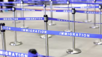 An image of an immigration boarding line.
