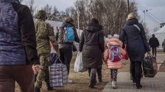 Refugees from Ukraine in Slovakia walking with luggage
