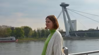 Ukrainian migrant looking out over bridge in Slovakia