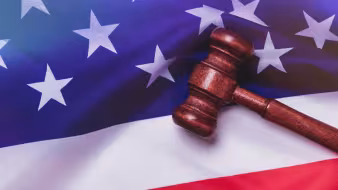 Image of gavel resting on U.S. flag