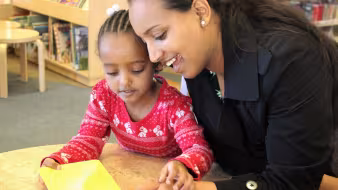 Mother and child reading.