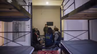 EU official with asylum-seeker family in Greece