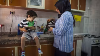 A refugee woman and child at home in Turkey