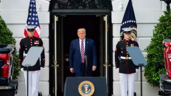 President Trump emerges from the White House to deliver remarks