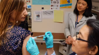A woman getting a vaccine