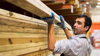 A man working at a lumber warehouse