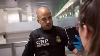 CBP officer screening travelers