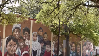 A mural on a Houston elementary school showing children of different backgrounds
