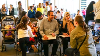 A family with young children at a naturalization ceremony.