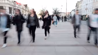 Blurred photo of people walking in Warsaw, Poland