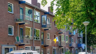 Ukraine flag hanging from an apartment building in the Netherlands