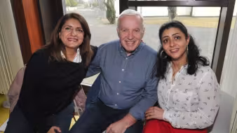 A Syrian refugee sits with her new neighbors in Ireland