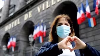 A Syrian refugee in France who has been assisting her neighbors during the pandemic