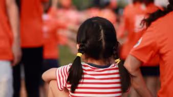 young child red