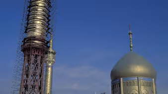 Scaffolding surrounds a mosque in Iran.