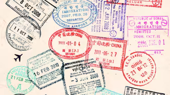 Image of passport page with variety of stamps