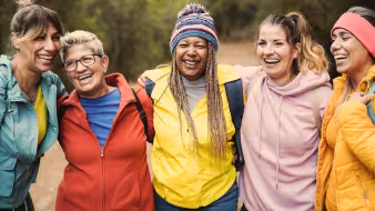 Image of women smiling on hike