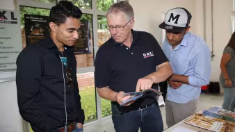Refugees attend a job training fair