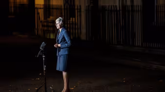 Theresa May speaks to reporters