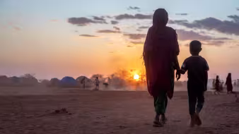 A woman and child walk in the Somali region of Ethiopia.