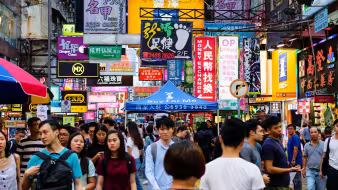 People walk through the streets of Hong Kong